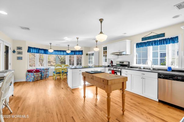 Dining room, Interior, Kitchen, Pendant Lights, Recessed Lighting, Stainless Steel Appliances, Wood Texture Flooring