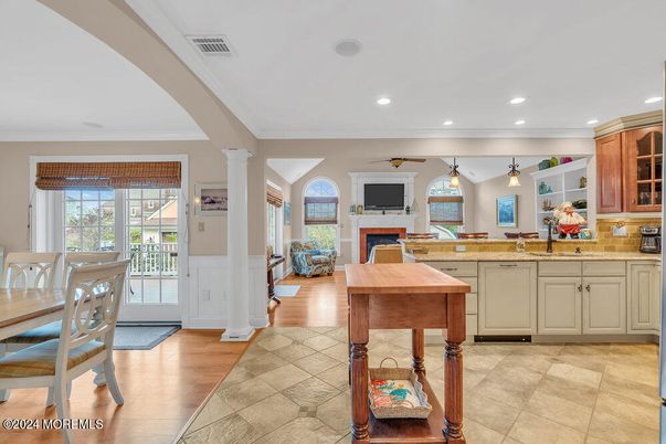 Dining room, Fireplace, Interior, Kitchen, Recessed Lighting, Wood Texture Flooring