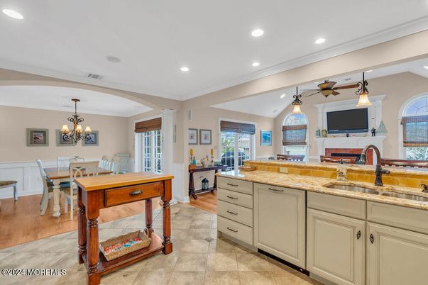 Chandelier, Dining room, Fireplace, Interior, Kitchen, Recessed Lighting, Wood Texture Flooring
