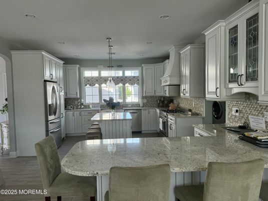 Dining room, Interior, Kitchen, Pendant Lights, Recessed Lighting, Stainless Steel Appliances, Wood Texture Flooring