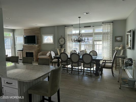 Chandelier, Dining room, Fireplace, Interior, Living room, Recessed Lighting, Wood Texture Flooring
