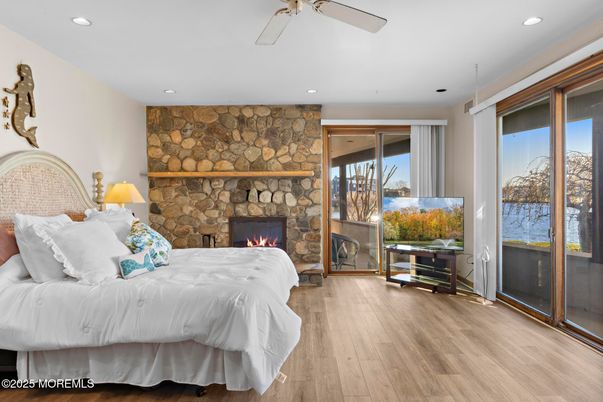 Bedroom, Fireplace, Interior, Recessed Lighting, Stone Walls, Wood Texture Flooring