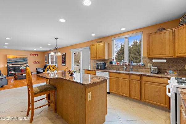 Chandelier, Dining room, Fireplace, Interior, Kitchen, Living room, Pendant Lights, Recessed Lighting, Wood Texture Flooring