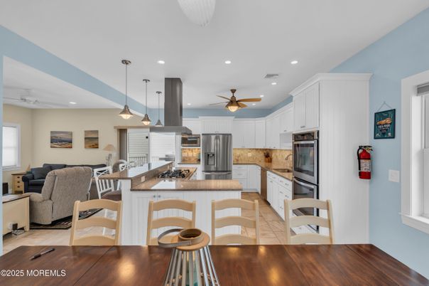 Dining room, Interior, Kitchen, Living room, Pendant Lights, Recessed Lighting, Stainless Steel Appliances, Wood Texture Flooring