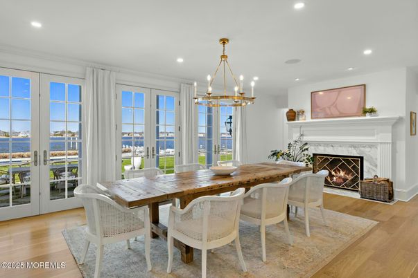 Dining room, Fireplace, Interior, Pendant Lights, Recessed Lighting, Water, Wood Texture Flooring
