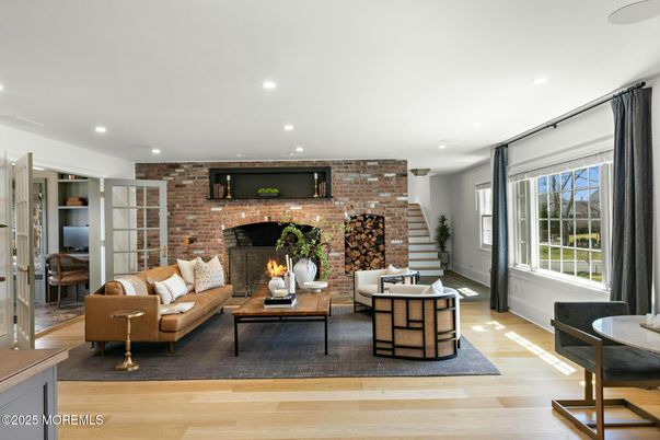 Fireplace, Interior, Living room, Recessed Lighting, Stone Walls, Wood Texture Flooring