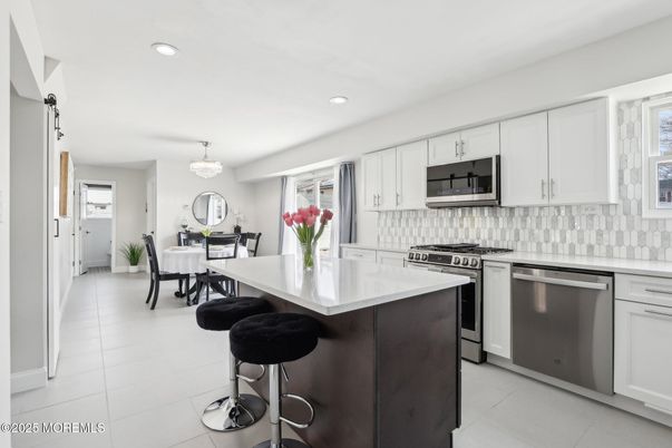 Chandelier, Dining room, Interior, Kitchen, Recessed Lighting, Stainless Steel Appliances