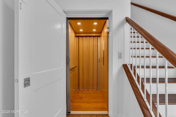 Elevator, Interior, Recessed Lighting, Wood Texture Flooring, Wooden Walls