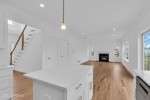 Empty room, Fireplace, Interior, Kitchen, Pendant Lights, Recessed Lighting, Wood Texture Flooring