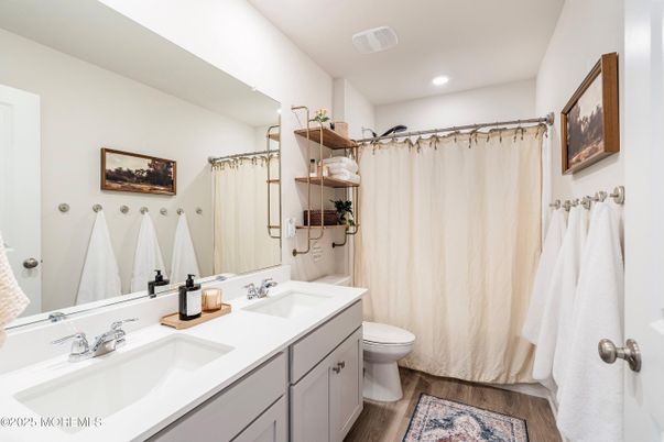 Bathroom, Dual Sink Vanities, Interior, Recessed Lighting, Wood Texture Flooring