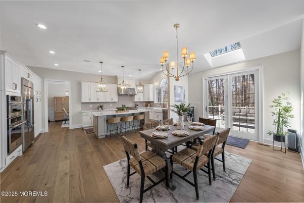 Chandelier, Dining room, Interior, Kitchen, Pendant Lights, Recessed Lighting, Stainless Steel Appliances, Wood Texture Flooring