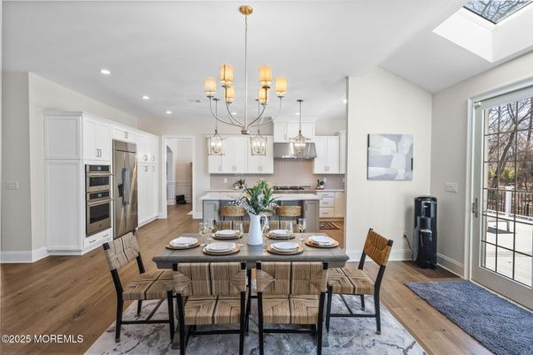 Chandelier, Dining room, Interior, Kitchen, Pendant Lights, Recessed Lighting, Stainless Steel Appliances, Wood Texture Flooring