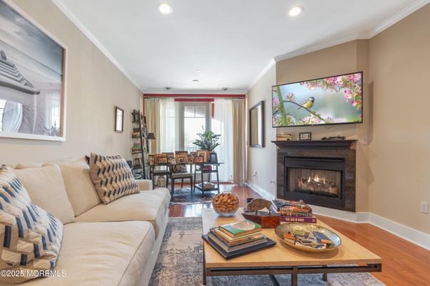 Dining room, Fireplace, Interior, Living room, Recessed Lighting, Wood Texture Flooring