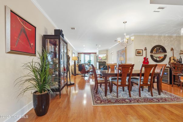 Chandelier, Dining room, Fireplace, Interior, Living room, Recessed Lighting, Wood Texture Flooring