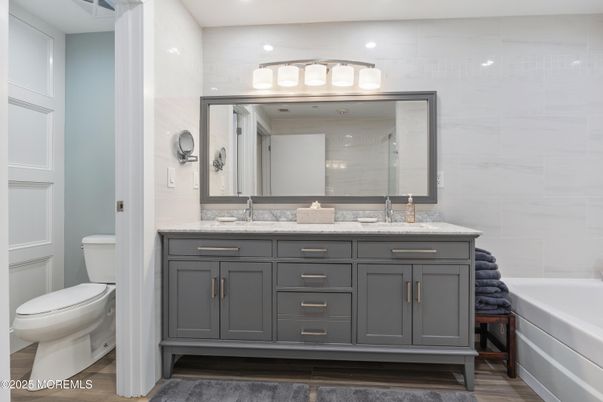 Bathroom, Dual Sink Vanities, Interior, Recessed Lighting, Wood Texture Flooring