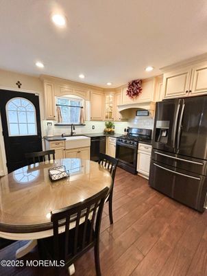 Dining room, Interior, Kitchen, Recessed Lighting, Stainless Steel Appliances, Wood Texture Flooring
