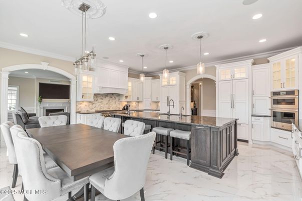 Dining room, Fireplace, Interior, Kitchen, Marble, Pendant Lights, Recessed Lighting, Stainless Steel Appliances