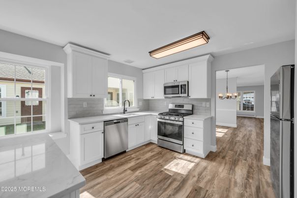 Chandelier, Interior, Kitchen, Pendant Lights, Stainless Steel Appliances, Wood Texture Flooring