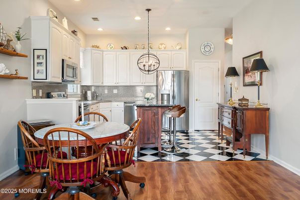 Dining room, Interior, Kitchen, Pendant Lights, Recessed Lighting, Stainless Steel Appliances, Wood Texture Flooring