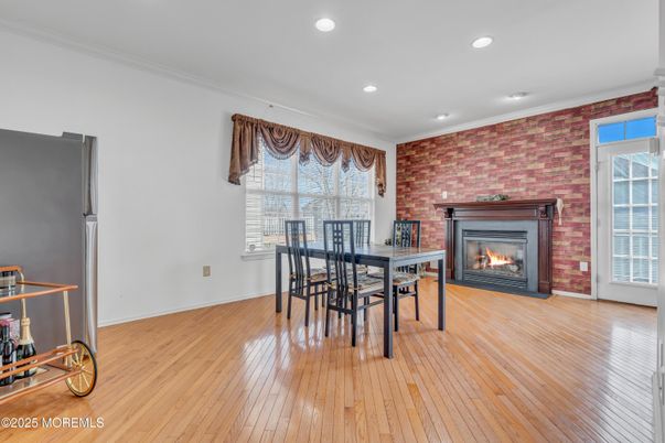 Dining room, Fireplace, Interior, Recessed Lighting, Stone Walls, Wood Texture Flooring
