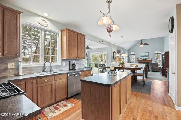 Dining room, Interior, Kitchen, Living room, Pendant Lights, Recessed Lighting, Stainless Steel Appliances, Wood Texture Flooring