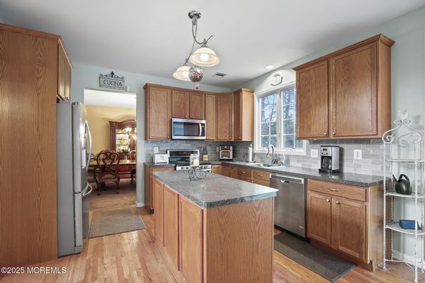 Dining room, Interior, Kitchen, Pendant Lights, Recessed Lighting, Stainless Steel Appliances, Wood Texture Flooring