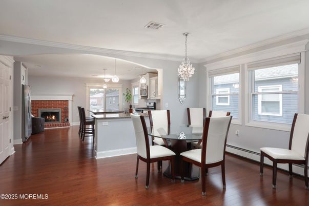 Chandelier, Dining room, Fireplace, Interior, Kitchen, Pendant Lights, Wood Texture Flooring