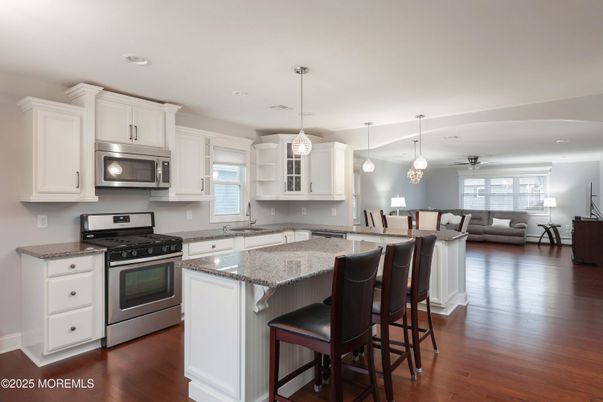 Dining room, Interior, Kitchen, Living room, Pendant Lights, Recessed Lighting, Stainless Steel Appliances, Wood Texture Flooring
