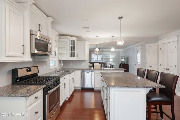 Dining room, Interior, Kitchen, Pendant Lights, Stainless Steel Appliances, Wood Texture Flooring