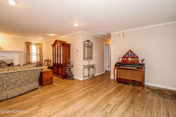 Fireplace, Interior, Piano, Recessed Lighting, Wood Texture Flooring