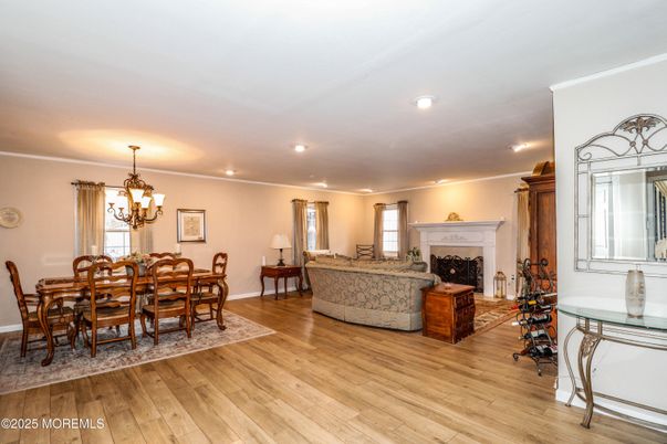 Chandelier, Dining room, Fireplace, Interior, Living room, Recessed Lighting, Wood Texture Flooring