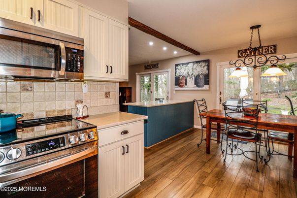 Dining room, Interior, Kitchen, Pendant Lights, Recessed Lighting, Stainless Steel Appliances, Wooden Beams, Wood Texture Flooring