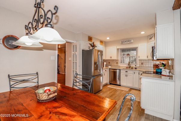 Dining room, Interior, Kitchen, Recessed Lighting, Stainless Steel Appliances, Wood Texture Flooring