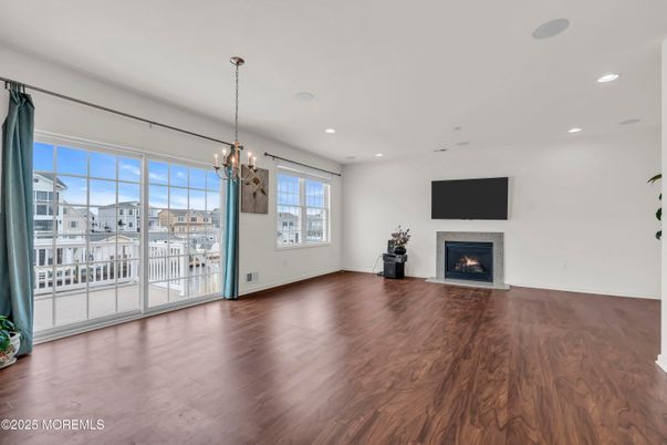 Chandelier, Empty room, Fireplace, Interior, Pendant Lights, Recessed Lighting, Wood Texture Flooring