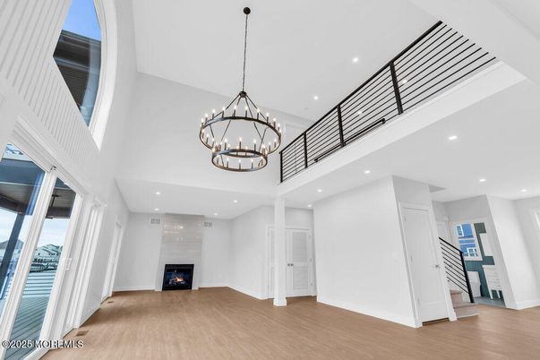 Chandelier, Fireplace, Interior, Recessed Lighting, Wood Texture Flooring