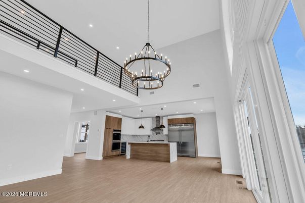 Chandelier, Interior, Kitchen, Pendant Lights, Recessed Lighting, Stainless Steel Appliances, Wood Texture Flooring