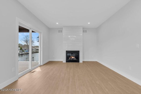 Empty room, Fireplace, Interior, Recessed Lighting, Wood Texture Flooring
