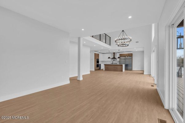 Chandelier, Interior, Kitchen, Recessed Lighting, Stainless Steel Appliances, Wood Texture Flooring