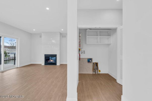 Empty room, Fireplace, Interior, Recessed Lighting, Wood Texture Flooring