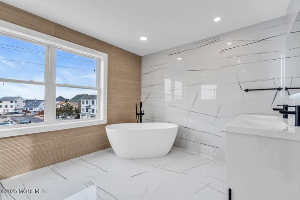 Bathroom, Dual Sink Vanities, Free Standing Baths, Interior, Marble, Marble Walls, Recessed Lighting