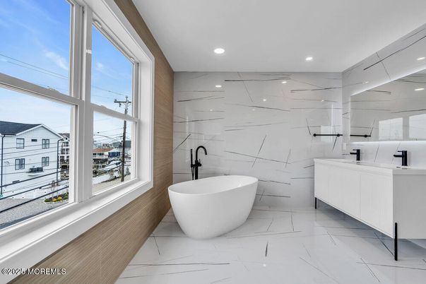 Bathroom, Dual Sink Vanities, Free Standing Baths, Interior, Marble, Marble Walls, Recessed Lighting
