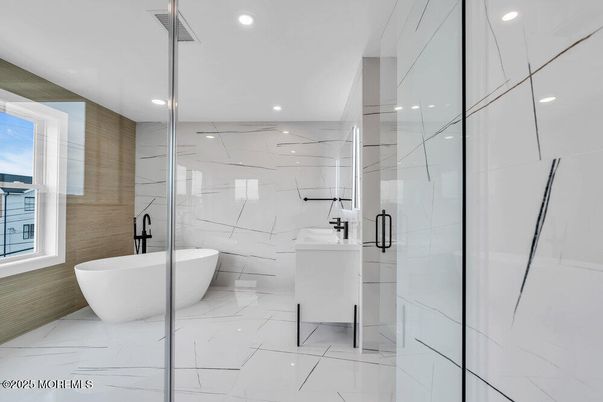 Bathroom, Free Standing Baths, Glass Shower, Interior, Marble, Marble Walls, Recessed Lighting