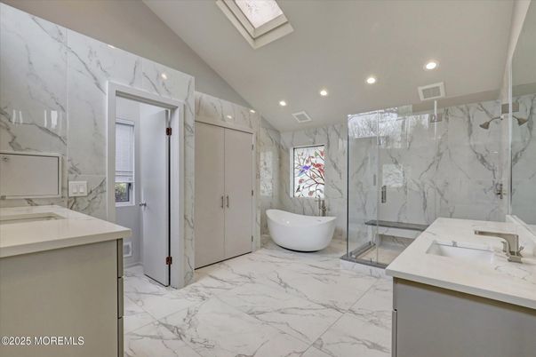 Bathroom, Dual Sink Vanities, Free Standing Baths, Glass Shower, Interior, Marble, Marble Walls, Recessed Lighting