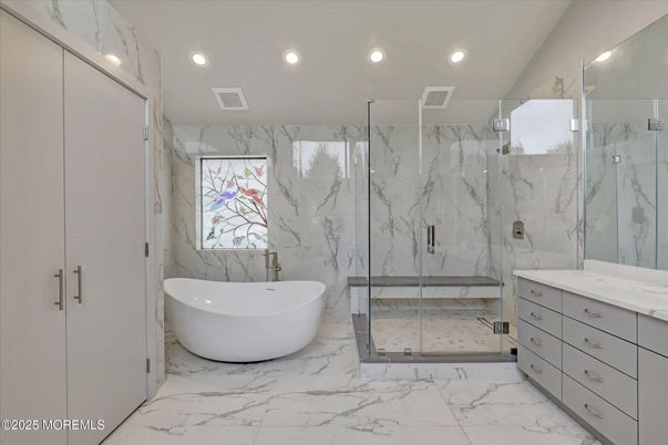 Bathroom, Free Standing Baths, Glass Shower, Interior, Marble, Marble Walls, Recessed Lighting