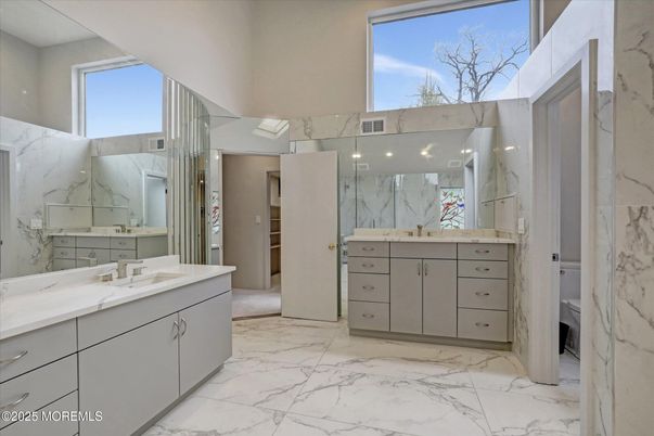 Bathroom, Dual Sink Vanities, Interior, Marble, Marble Walls, Recessed Lighting