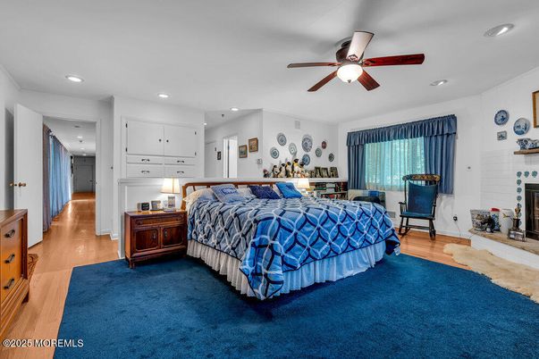 Bedroom, Fireplace, Interior, Recessed Lighting, Wood Texture Flooring