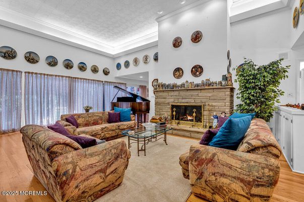 Fireplace, Interior, Living room, Piano, Recessed Lighting, Wood Texture Flooring