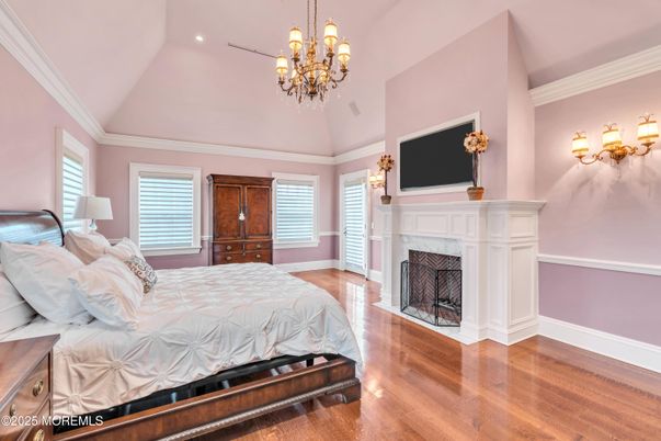 Bedroom, Chandelier, Fireplace, Interior, Recessed Lighting, Wood Texture Flooring
