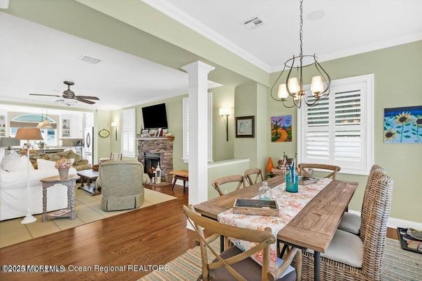 Chandelier, Dining room, Fireplace, Interior, Living room, Pendant Lights, Wood Texture Flooring