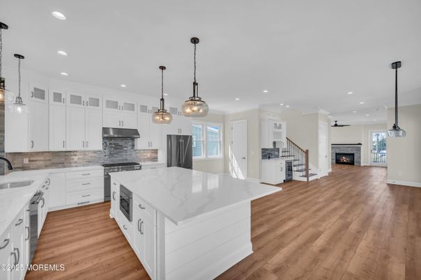 Fireplace, Interior, Kitchen, Pendant Lights, Recessed Lighting, Stainless Steel Appliances, Wood Texture Flooring